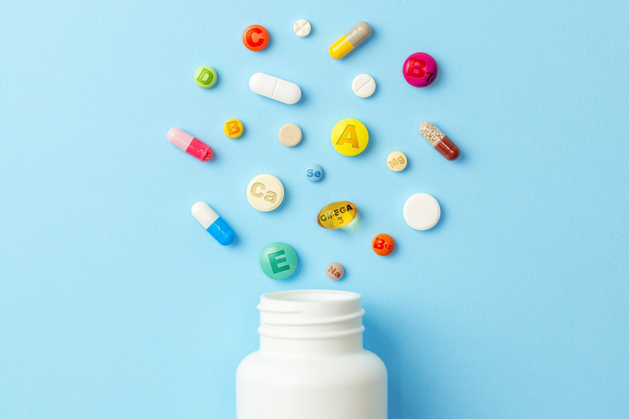 vitamin tablets bottle colored pills
