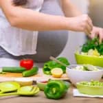 Pregnant woman preparing healthy pregnancy food