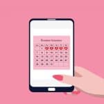 Fertility apps showing ovulation calculator on smartphone tracking fertile days