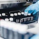 Prices Sperm bank in London - Laboratory technician handling frozen sperm samples at London fertility clinic