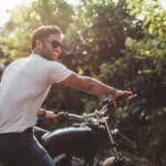 Man on motorcycle representing concept to find free sperm donors for co-parenting arrangements