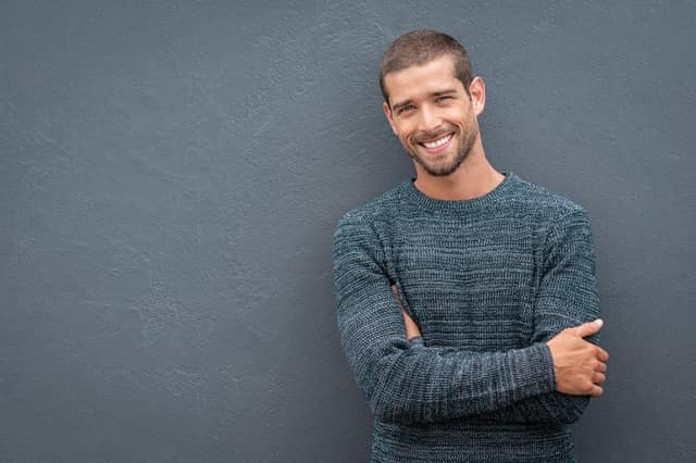 Find sperm donor UK concept with smiling young man representing potential donor profile
