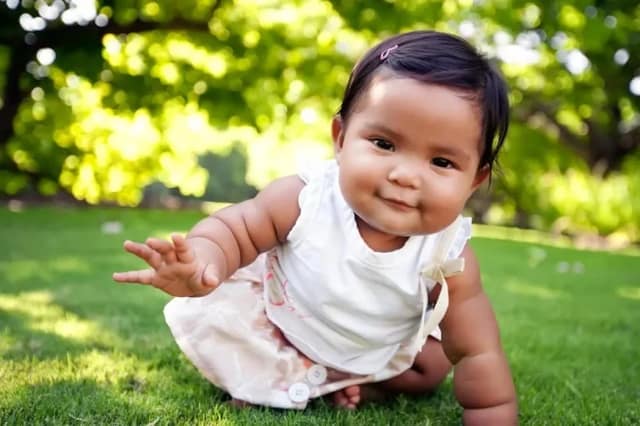 adoption uk concept with smiling young child playing outdoors in a safe and happy family environment