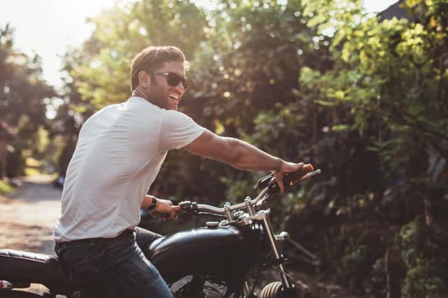 Man on motorcycle representing concept to find free sperm donors for co-parenting arrangements