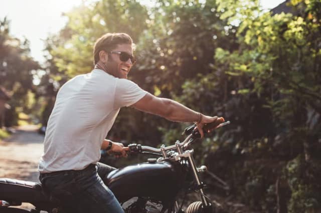 Man on motorcycle representing concept to find free sperm donors for co-parenting arrangements