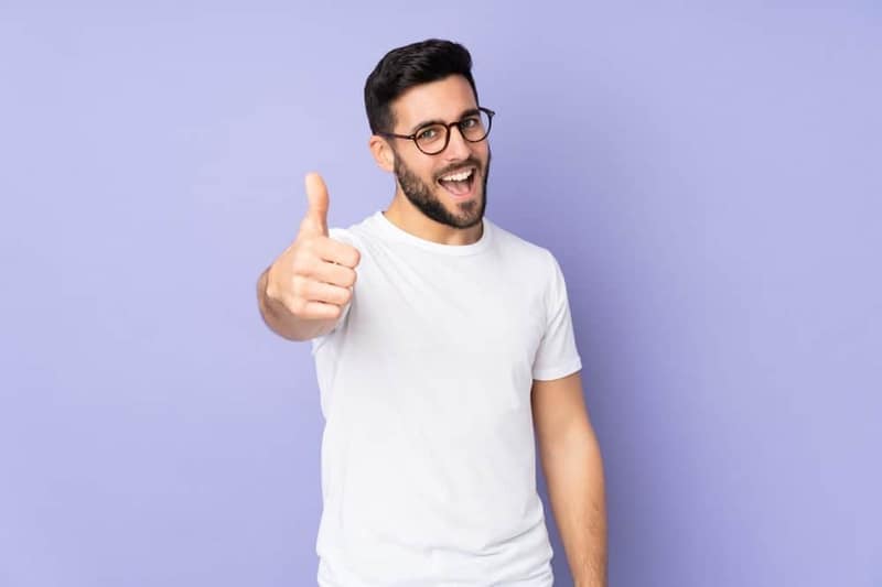 Handsome man with thumbs up