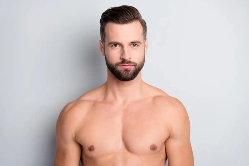 Close portrait of attractive well-groomed man with serious expression representing potential sperm donor candidate for fertility program