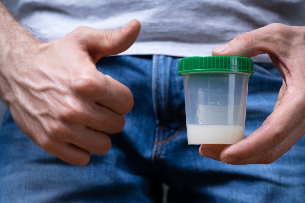 sperm-donor-holding-container-making-thumbs