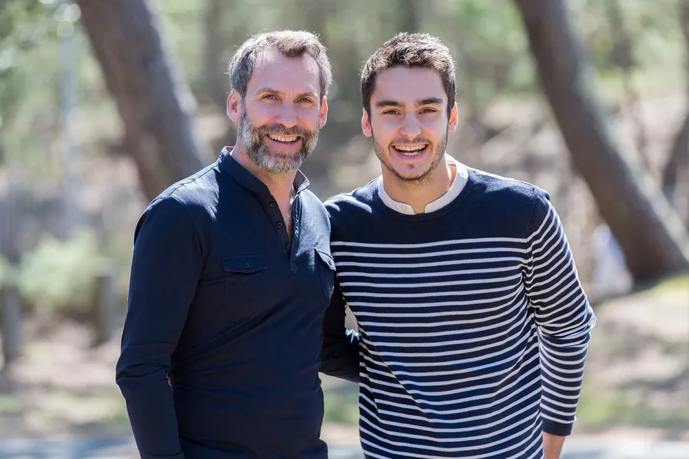 sperm donor contact meeting between two men in a friendly outdoor setting