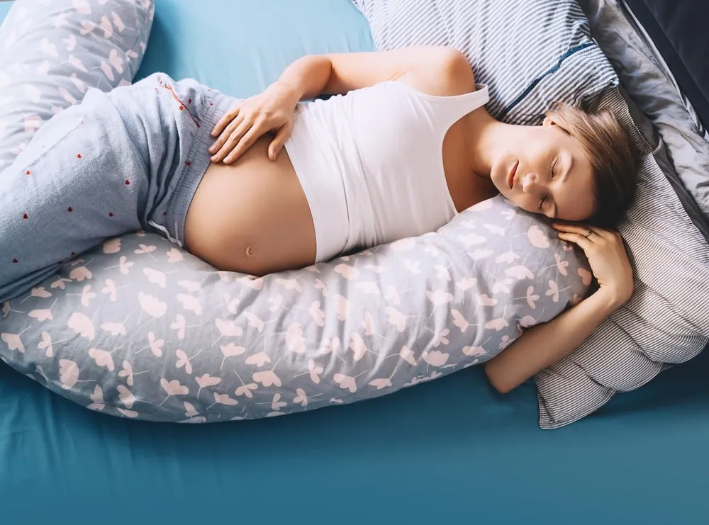 Bed rest ideas pregnant woman resting comfortably on pillow during pregnancy
