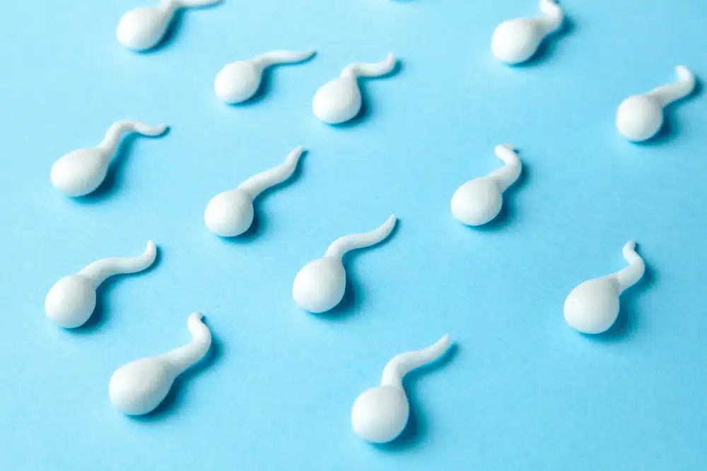 group sperm on blue background