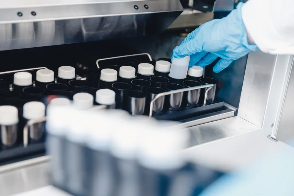 Sperm bank London prices - Laboratory technician handling frozen sperm samples at London fertility clinic