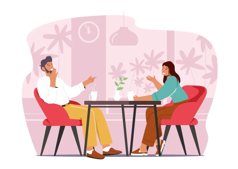 Man and woman on a casual date talking over coffee in a café